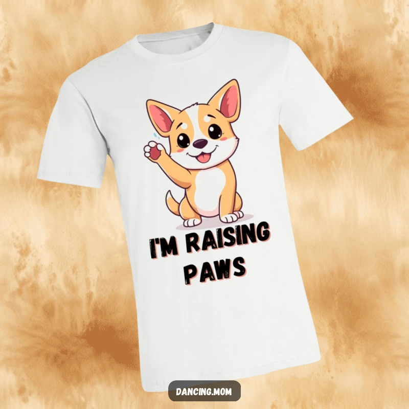 Funny t-shirt depicting a dog striking a playful pose, with one paw triumphantly raised high, radiating joy.